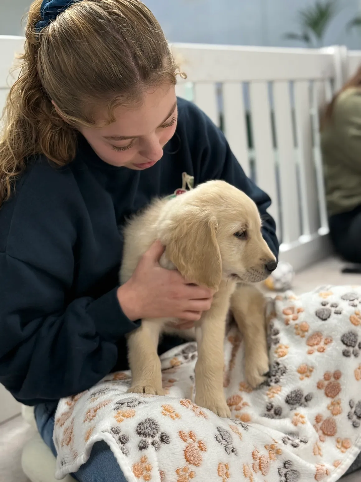 Young woman holding a puppy