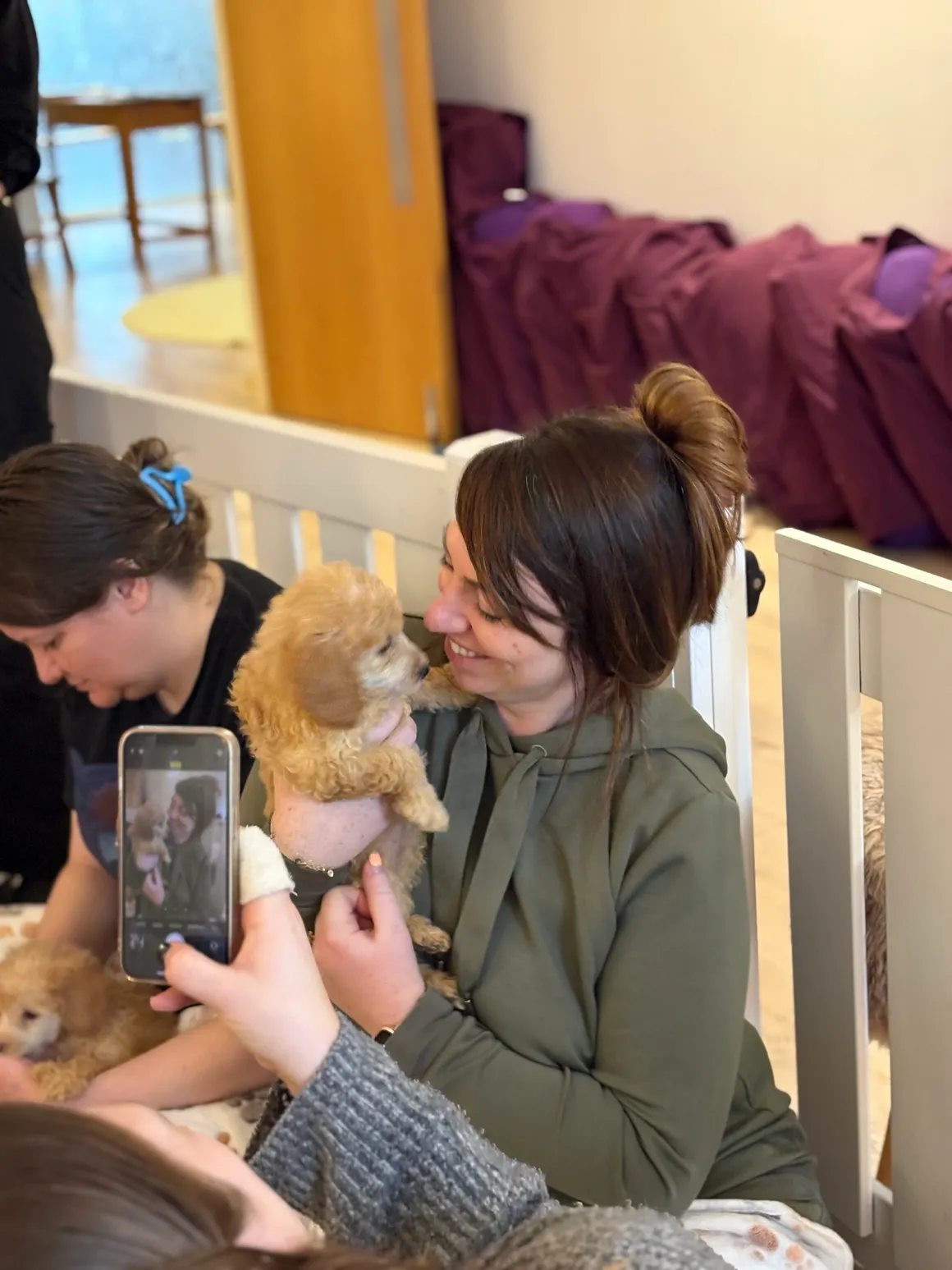 Puppy and woman sharing a moment