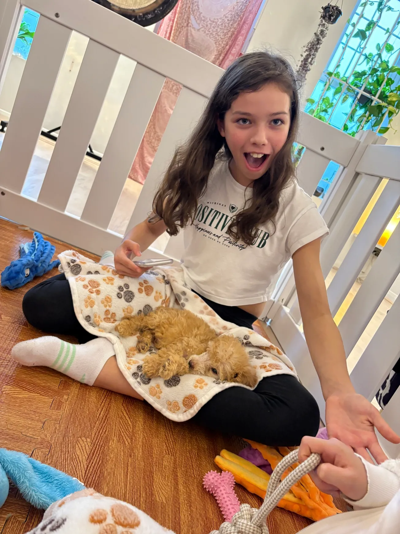 Girl with puppy on her lap